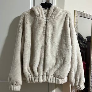 Cream cozy Sherpa Jacket with pockets on the side with cuffed sleeves and a hood